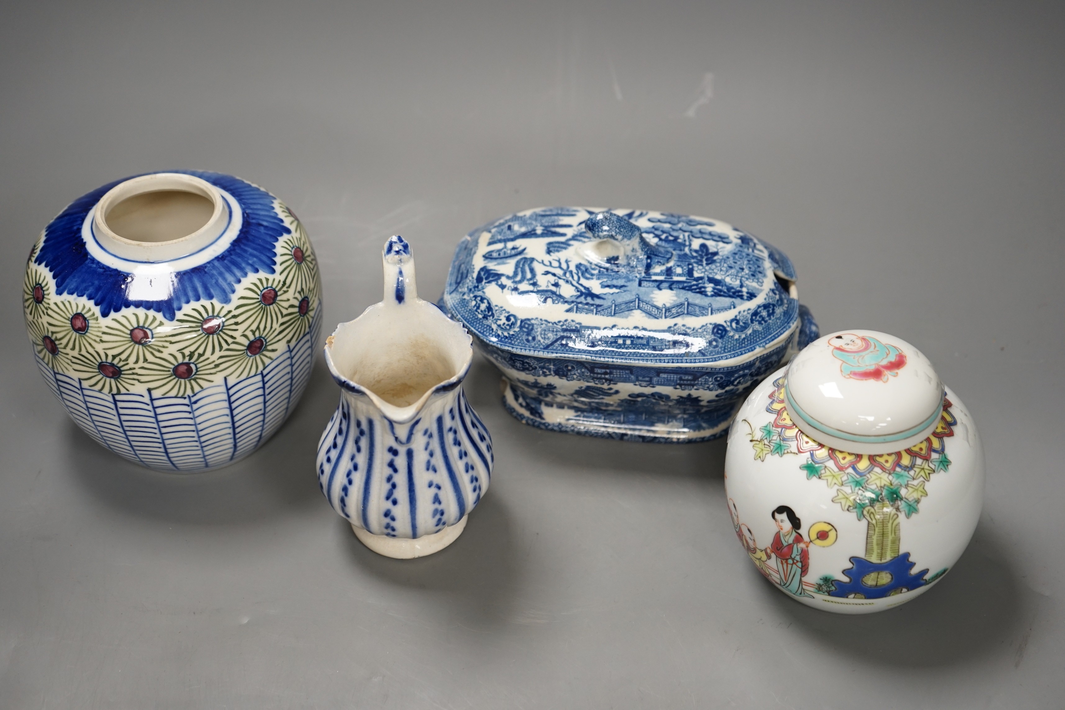 A Chinese famille rose jar and cover, another jar and two English pottery pieces